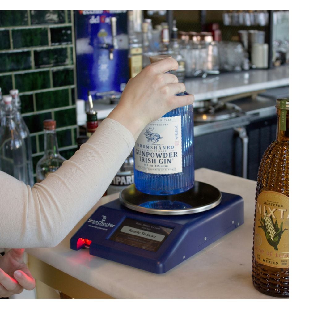 Weighing liquor bottle on Freepour liquor inventory scale